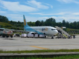 Passengers board an airliner at the Veer Savarkar airport at Port Blair