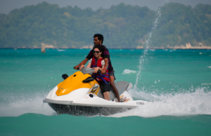 A tourist enjoying a ride in a Water Scooters at the Andaman Water Sports Complex.