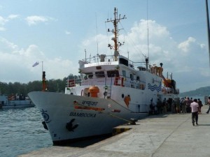 Tourist boarding a  Government Ferry at a Jetty