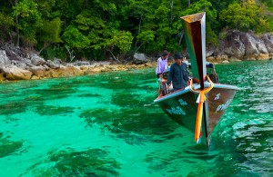 Tourist on a boat exploring the virgin Islands of Andaman