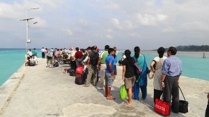 Tourist line up at a Jetty