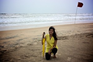 A tourist enjoys a beach side stroll at Tarkarli.