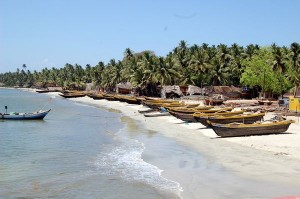 Fishermen line their fishing boats on a secluded area of the beach
