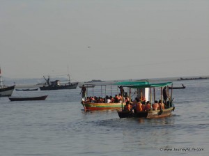 A boat ferries scuba divers to a dive spot.