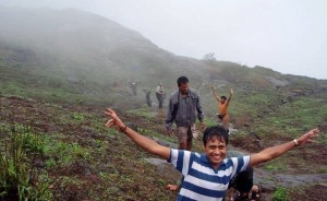 Trekkers enjoy a brief shower during their trek