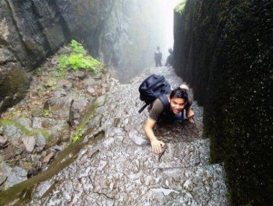 A trekker makes his way on the wet stairs of Sudhagad Fort during the monsoon 