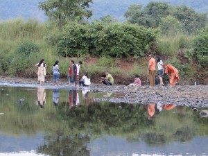 Tourist spend some time at the banks of the Amba River