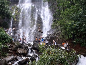 Tourist enjoy a weekend by a waterfall near Pune