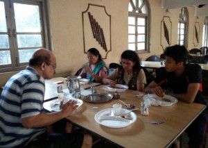 A family enjoys a meal at a restaurant in Lonavala