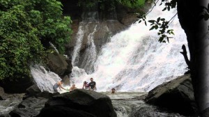 Tourist enjoy themselves at the falls. 